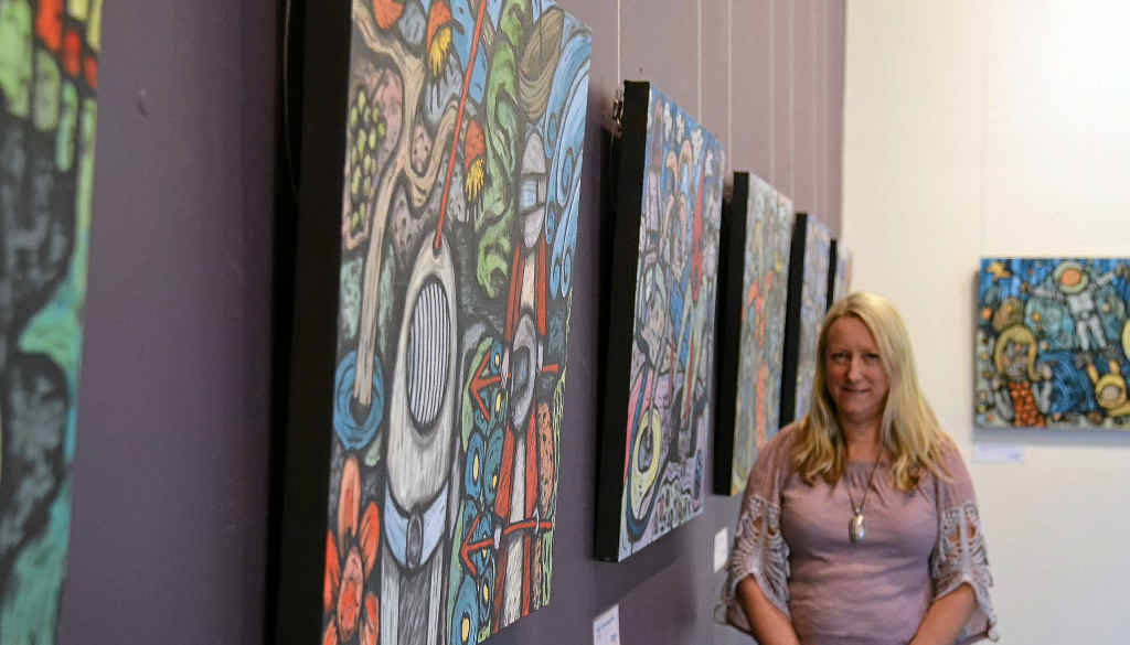 Warwick Regional Art Gallery director Karina Devine with some of the works from the gallery’s new exhibition iNASA.